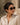 Female model wearing Aura sunglasses from Intimates